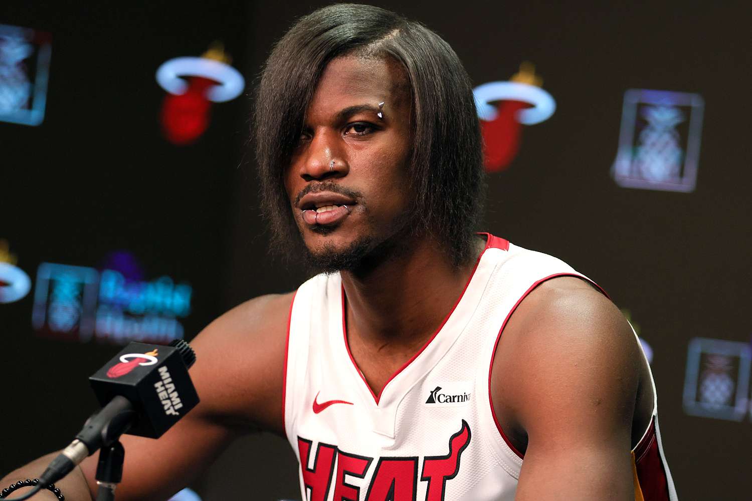 Report: Why Heat’s star Jimmy Butler has ’emo’ haircut, lip and nose rings in photos for 2023-24 season…
